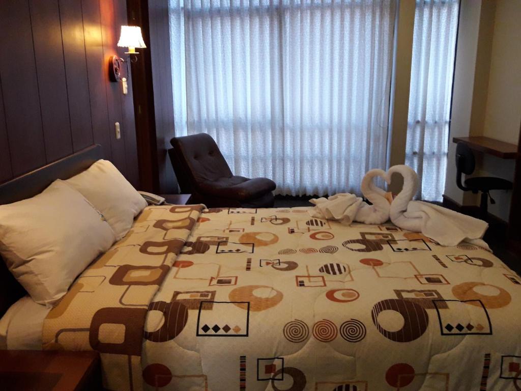 Postel nebo postele na pokoji v ubytování Hotel Imperial