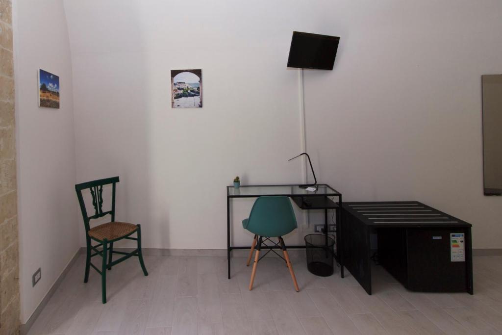 TV a/nebo společenská místnost v ubytování Il sentiero dell'Itria - Camere con vista