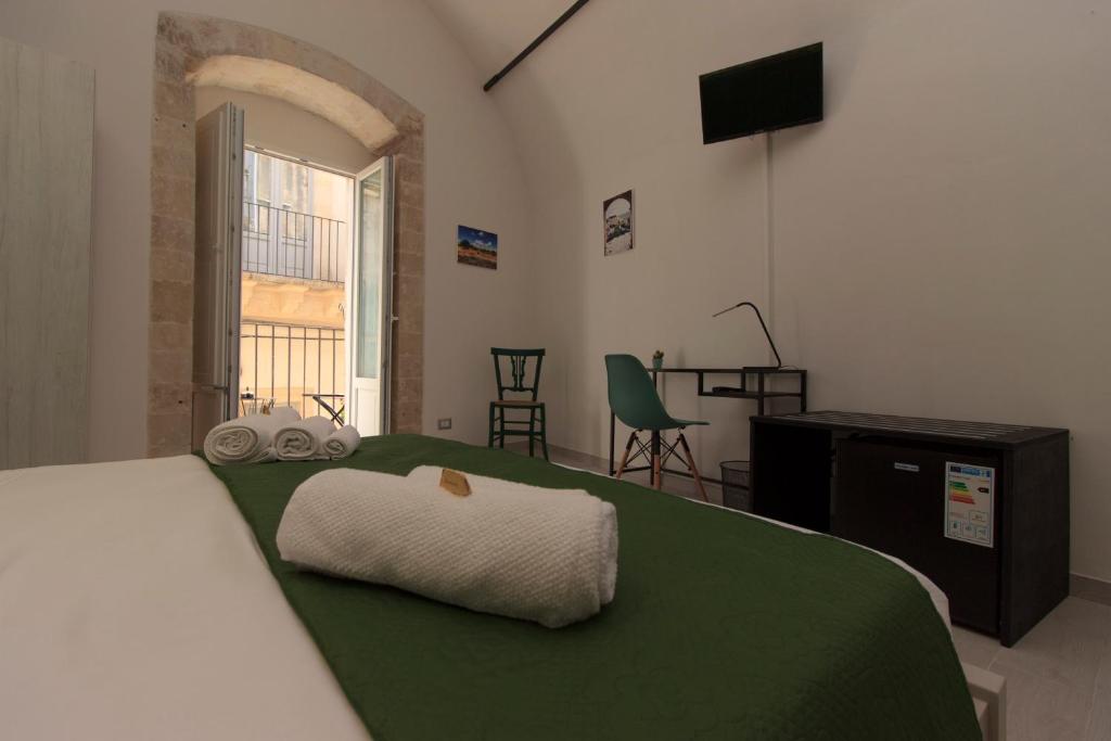 Postel nebo postele na pokoji v ubytování Il sentiero dell'Itria - Camere con vista
