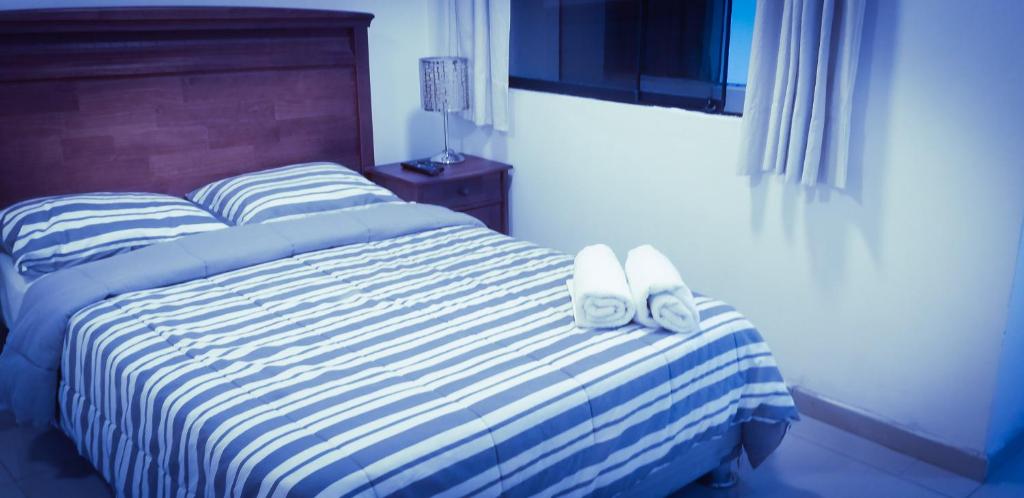 Postel nebo postele na pokoji v ubytování Peruvian Family Hostal Miraflores