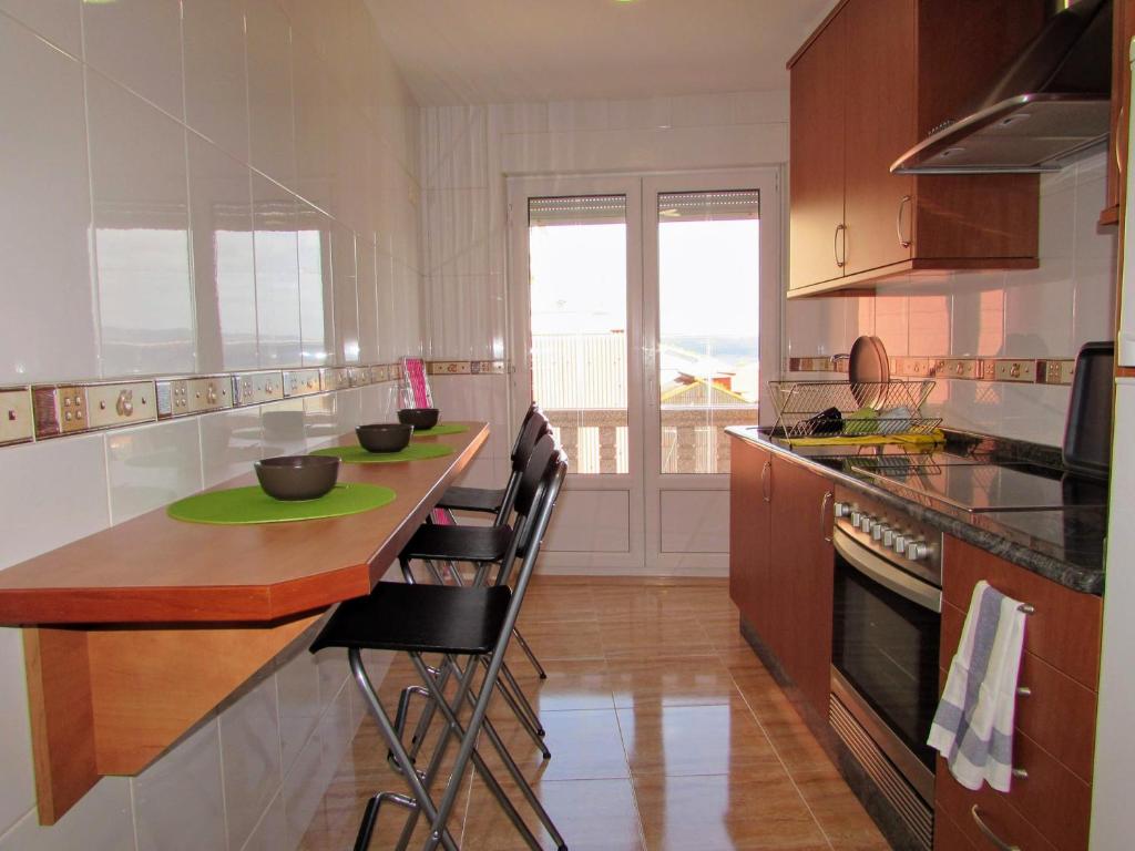 Kuchyň nebo kuchyňský kout v ubytování Apartamento en centro de Fisterra