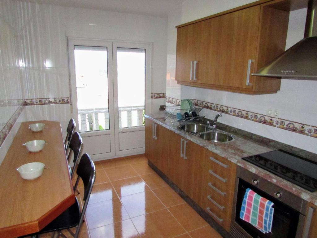 Kuchyň nebo kuchyňský kout v ubytování Apartamento en centro de Fisterra