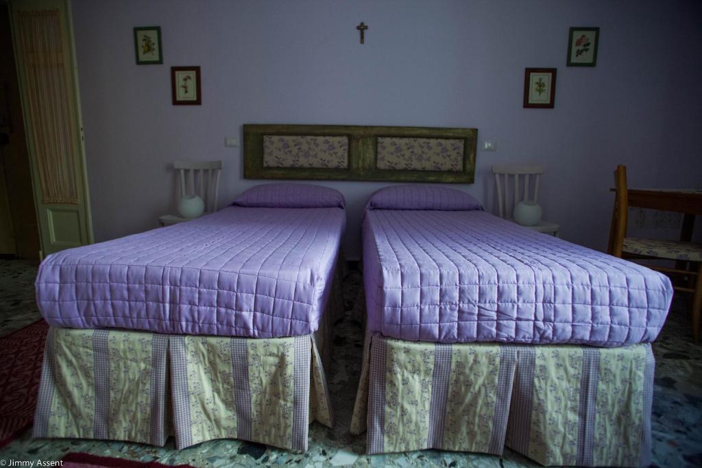 Postel nebo postele na pokoji v ubytování Sassari-In