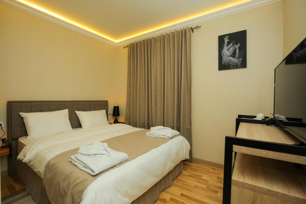 Postel nebo postele na pokoji v ubytování CHALET DILIJAN Hotel & Restauarant