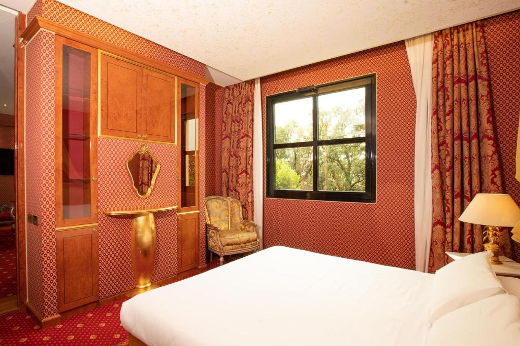 Postel nebo postele na pokoji v ubytování SHG Hotel Antonella