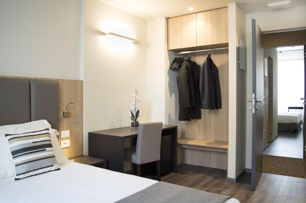 Postel nebo postele na pokoji v ubytování Hotel Alexander