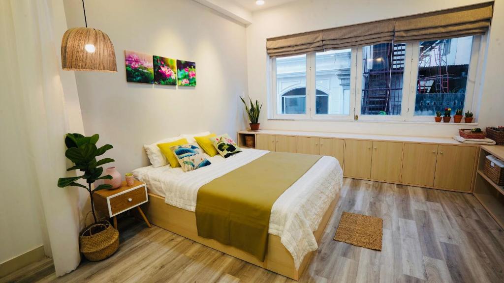 Ein Bett oder Betten in einem Zimmer der Unterkunft Botanic House Saigon