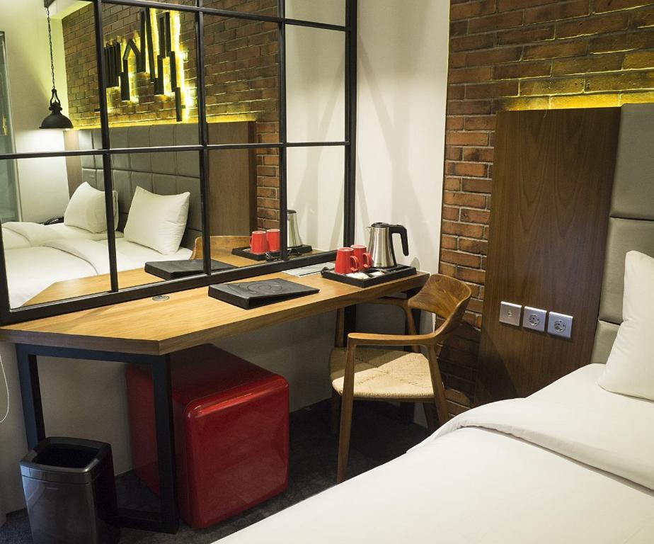 Postel nebo postele na pokoji v ubytování Posto Dormire Hotel