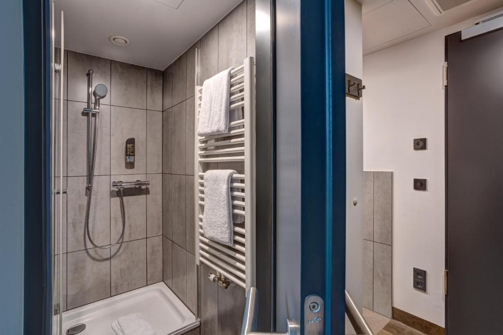 Koupelna v ubytování MEININGER Hotel München Olympiapark