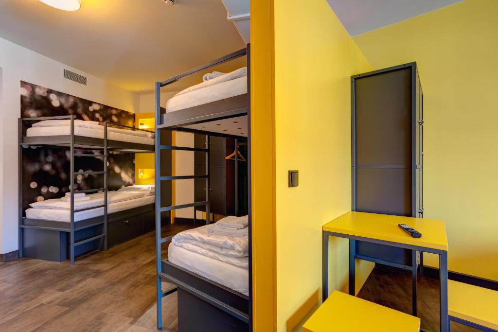 Postel nebo postele na pokoji v ubytování MEININGER Hotel München Olympiapark