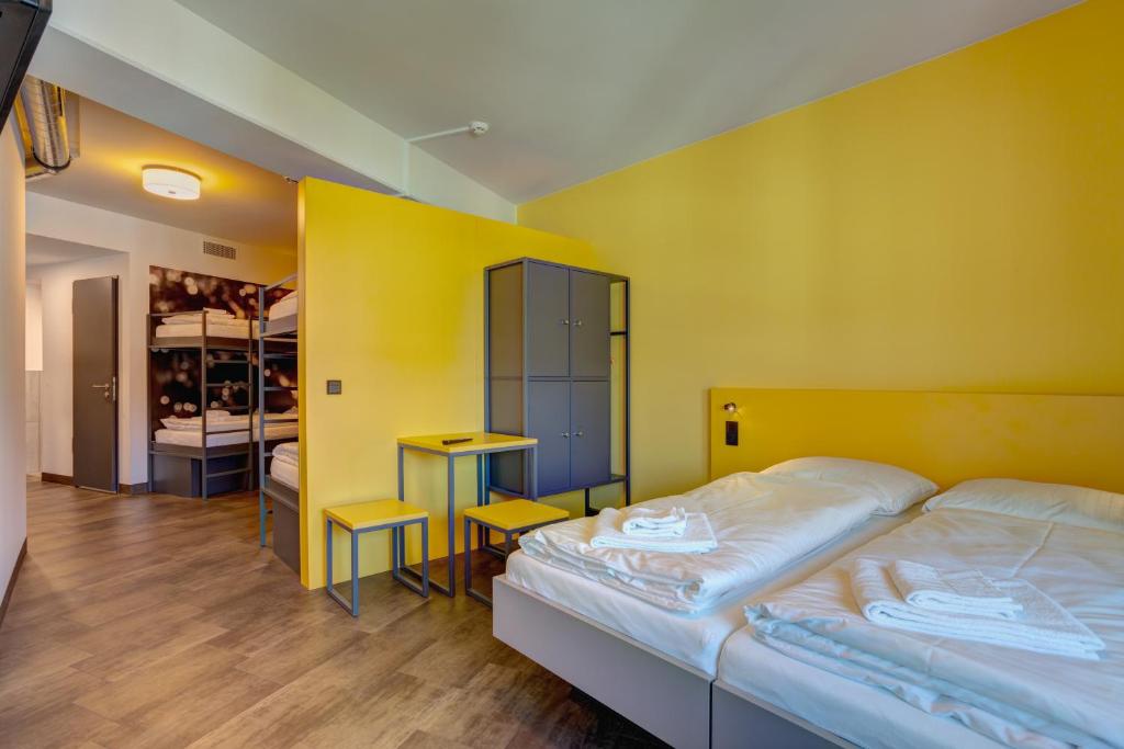 Postel nebo postele na pokoji v ubytování MEININGER Hotel München Olympiapark