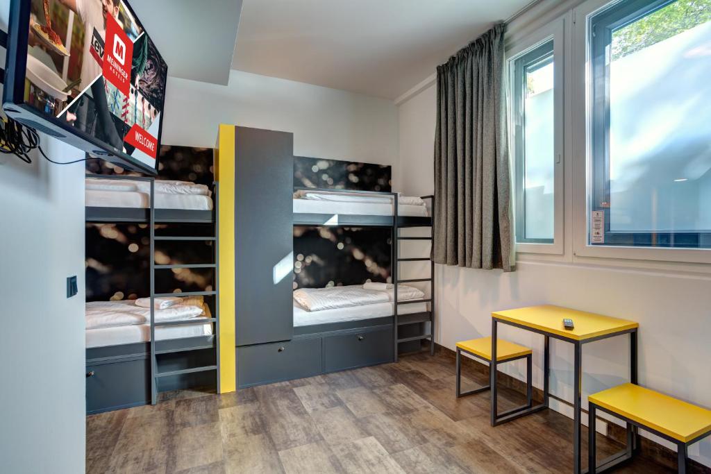 Postel nebo postele na pokoji v ubytování MEININGER Hotel München Olympiapark