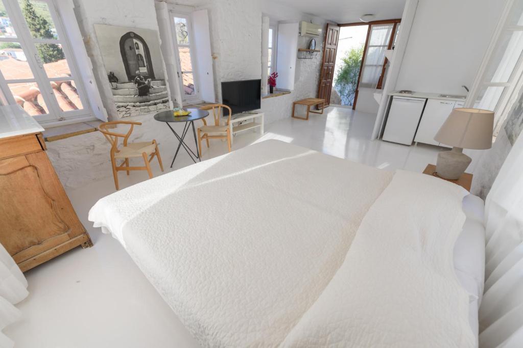 Ένα ή περισσότερα κρεβάτια σε δωμάτιο στο VITA REAL ESTATE