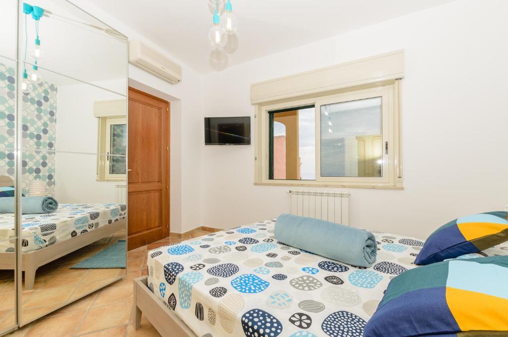 Posteľ alebo postele v izbe v ubytovaní Sunset Holiday Home Taormina