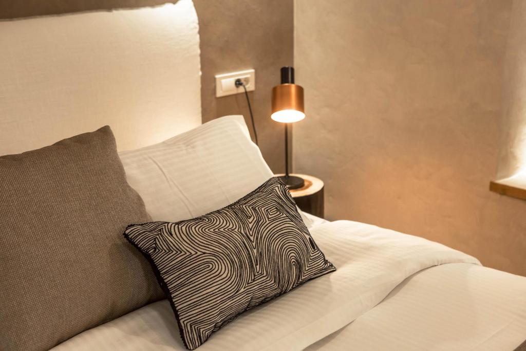 Posteľ alebo postele v izbe v ubytovaní J&G Suites