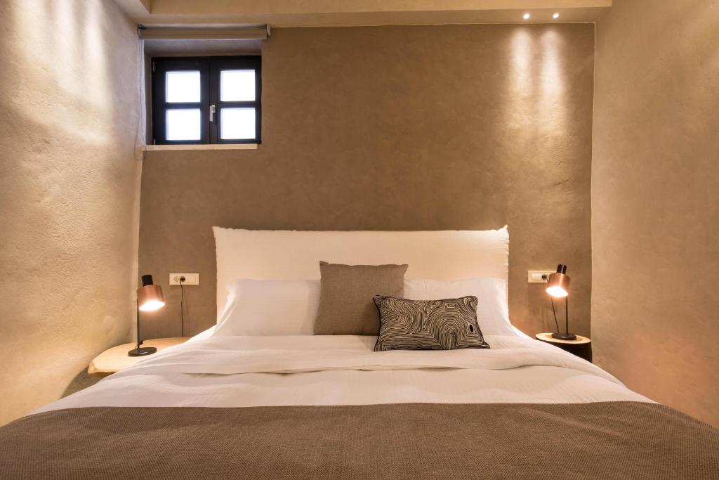 Posteľ alebo postele v izbe v ubytovaní J&G Suites