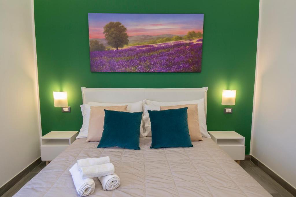 Posteľ alebo postele v izbe v ubytovaní B&B Maremy... I 4 Elementi