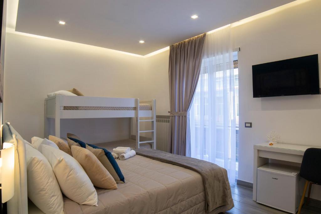 Posteľ alebo postele v izbe v ubytovaní B&B Maremy... I 4 Elementi