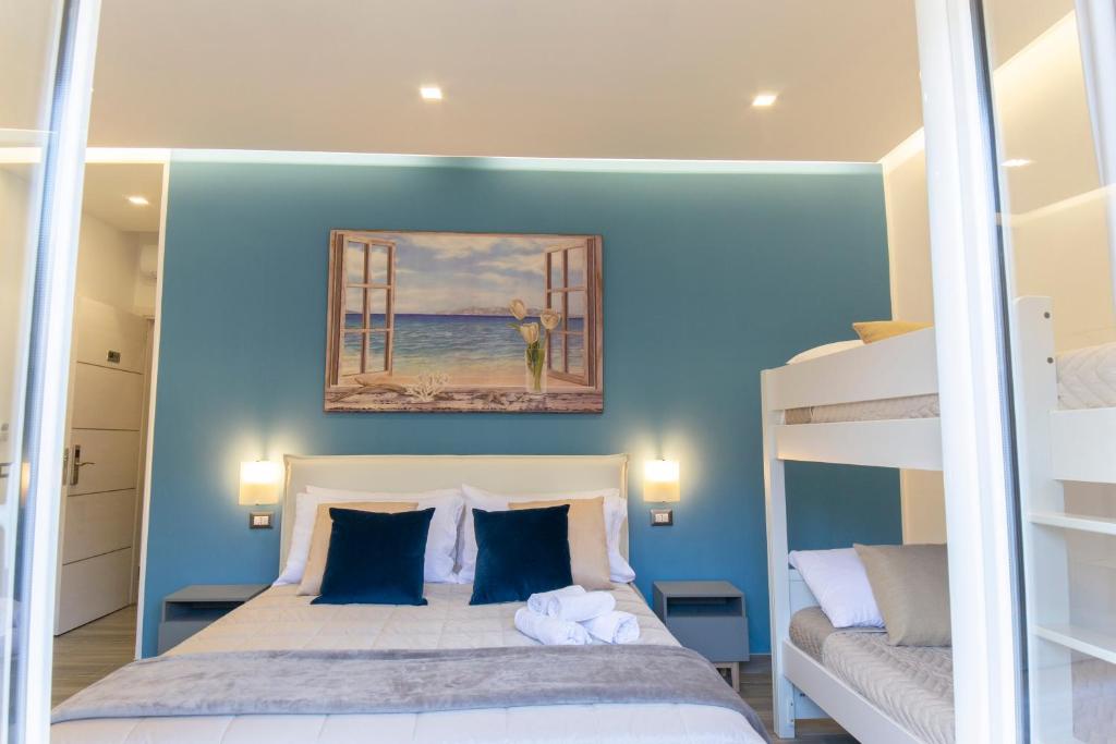 Posteľ alebo postele v izbe v ubytovaní B&B Maremy... I 4 Elementi