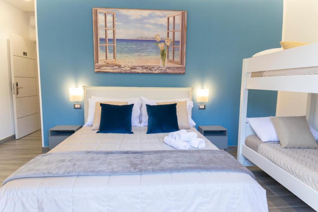 Posteľ alebo postele v izbe v ubytovaní B&B Maremy... I 4 Elementi