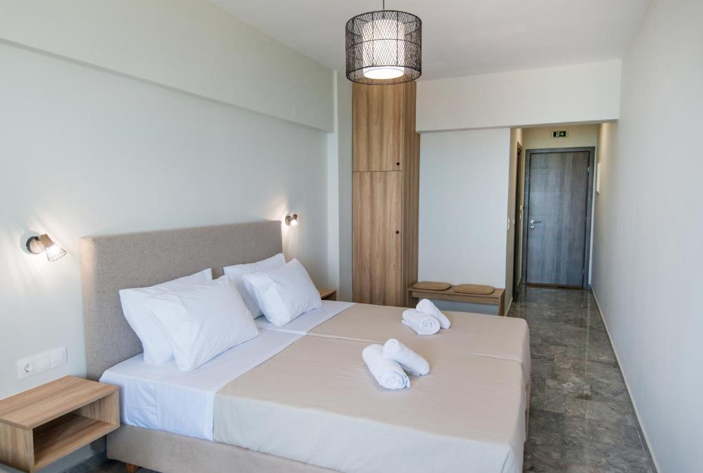 Postel nebo postele na pokoji v ubytování Birais Beach Studios