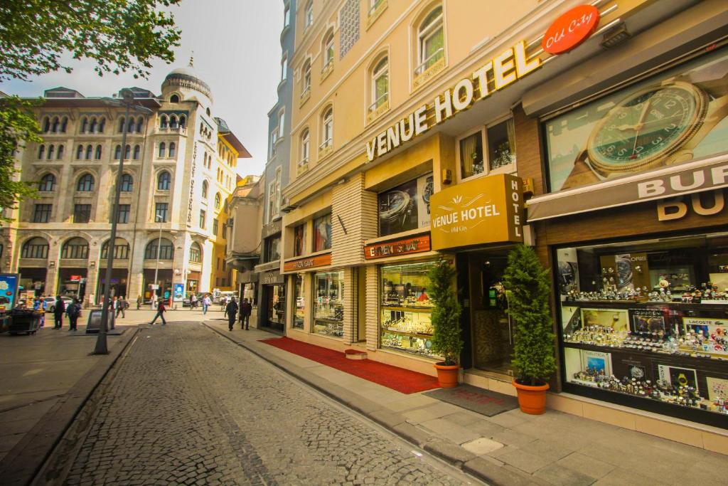 a street with shops and buildings in a city at Venue Hotel Istanbul Old City in Istanbul