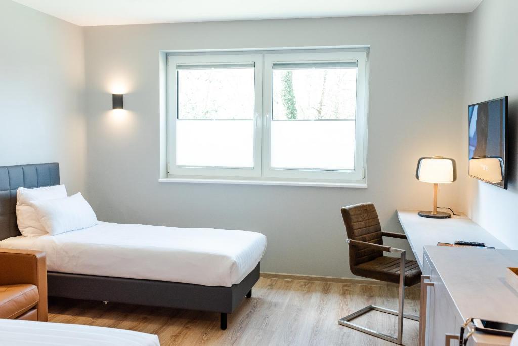 Postel nebo postele na pokoji v ubytování Hotel Circle Inn