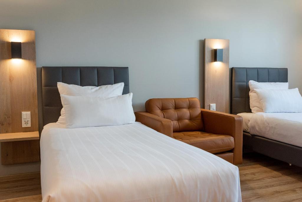 Postel nebo postele na pokoji v ubytování Hotel Circle Inn