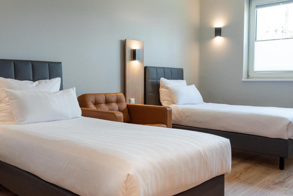 Postel nebo postele na pokoji v ubytování Hotel Circle Inn