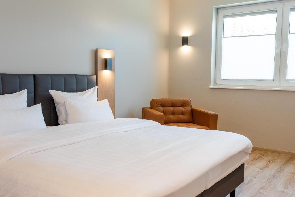 Postel nebo postele na pokoji v ubytování Hotel Circle Inn