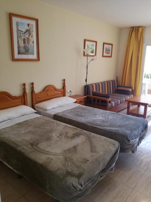 Postel nebo postele na pokoji v ubytování Apartamentos Parque Carolina