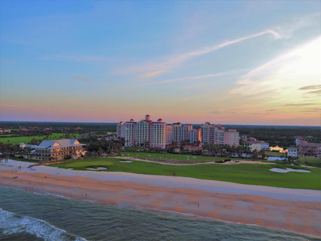 
a beach scene with a large body of water at Hammock Beach Golf Resort & Spa in Palm Coast
