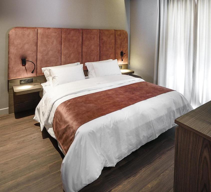 Łóżko lub łóżka w pokoju w obiekcie Roomore Apartments