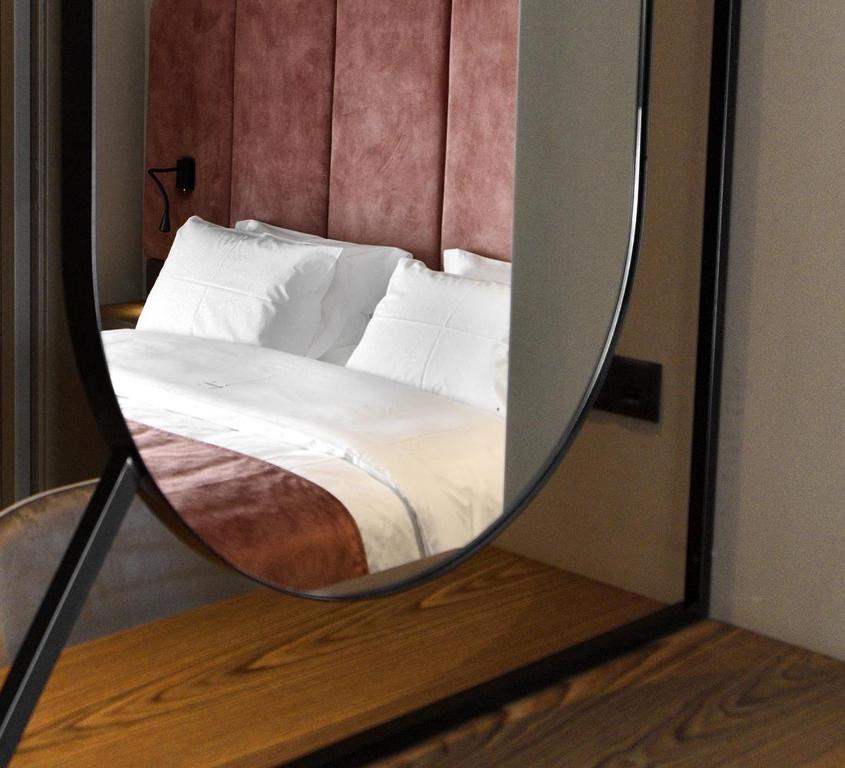 Łóżko lub łóżka w pokoju w obiekcie Roomore Apartments
