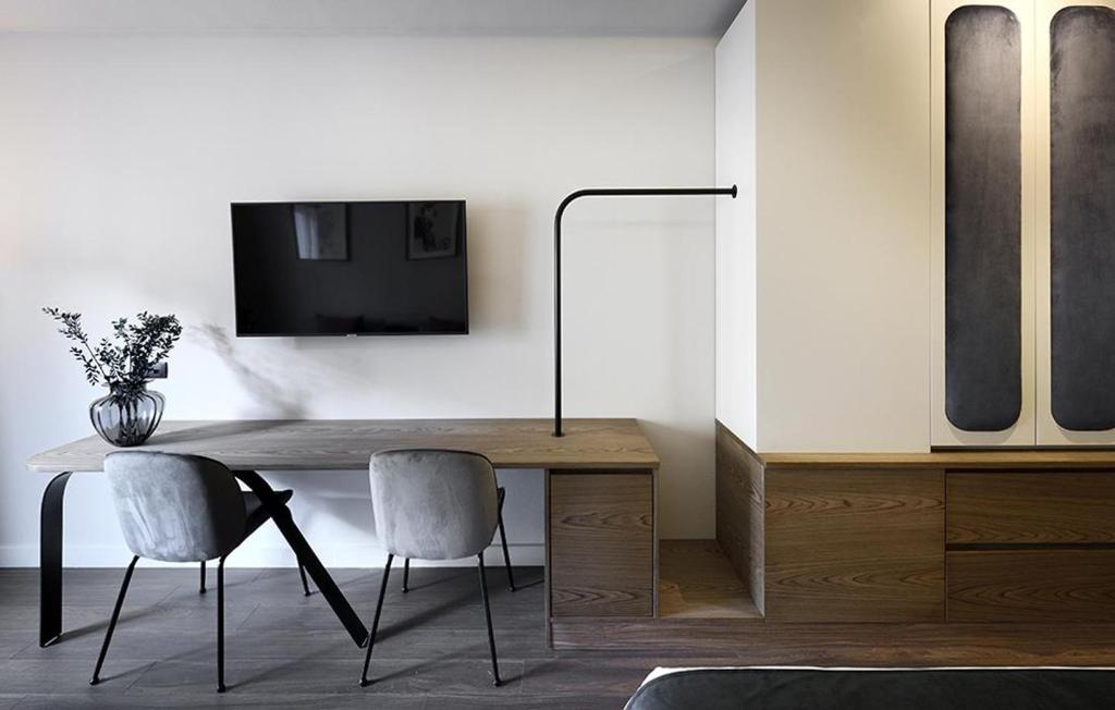 Telewizja i/lub zestaw kina domowego w obiekcie Roomore Apartments
