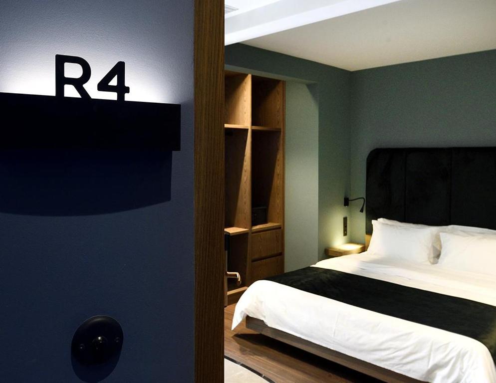 Łóżko lub łóżka w pokoju w obiekcie Roomore Apartments