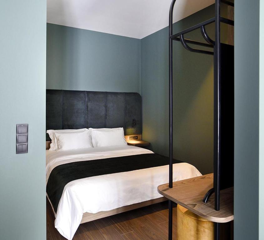 Łóżko lub łóżka w pokoju w obiekcie Roomore Apartments