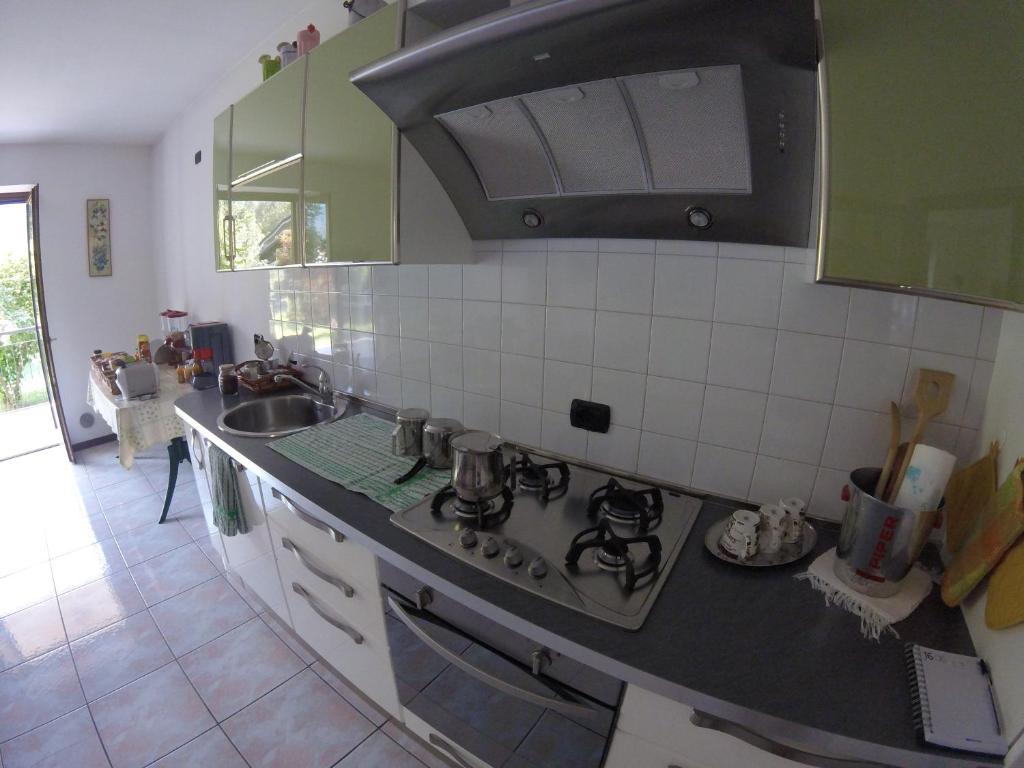 Kuchyň nebo kuchyňský kout v ubytování B&B Carunei