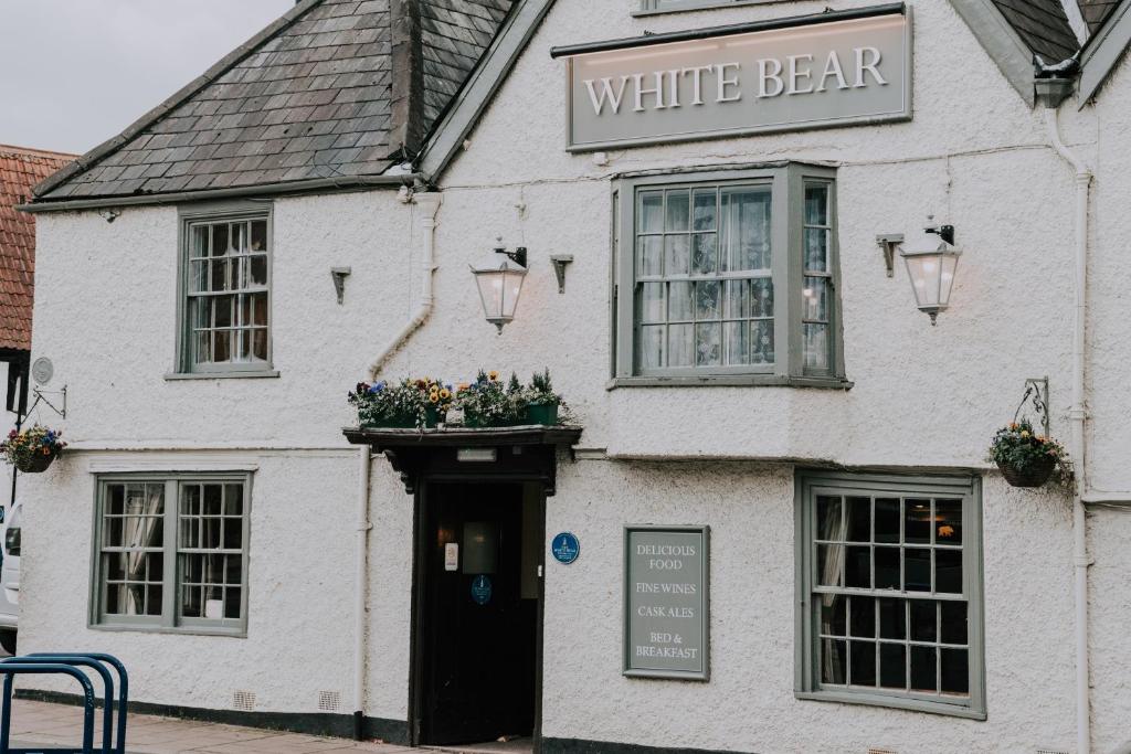 a white building with a white bear sign on it at The White Bear in Devizes