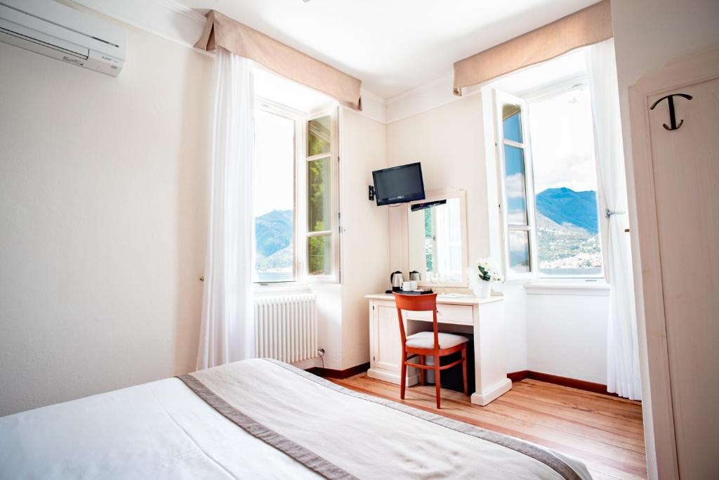 Łóżko lub łóżka w pokoju w obiekcie Hotel Villa Aurora