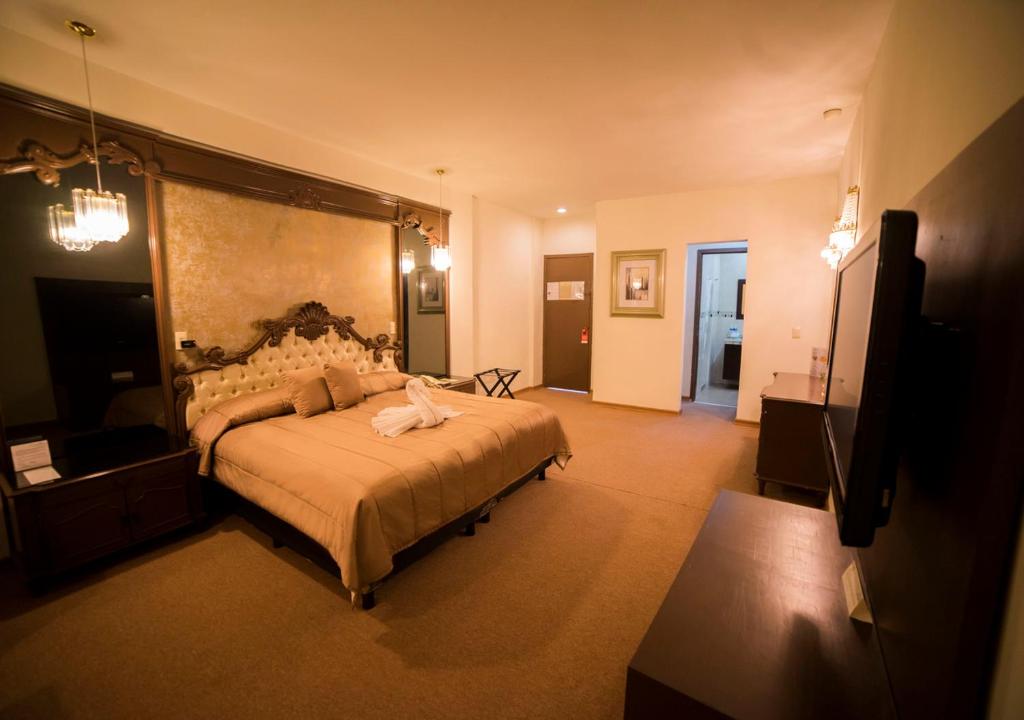 Postel nebo postele na pokoji v ubytování Hotel Marlon