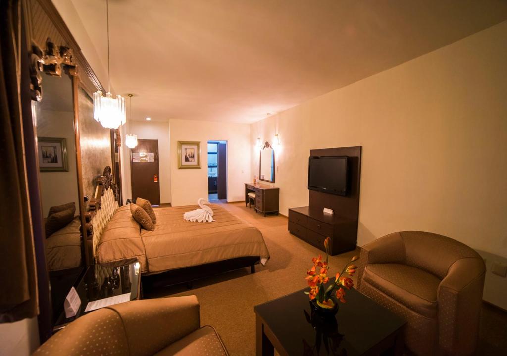 Postel nebo postele na pokoji v ubytování Hotel Marlon