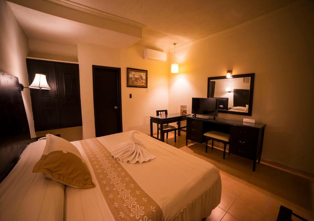 Postel nebo postele na pokoji v ubytování Hotel Marlon