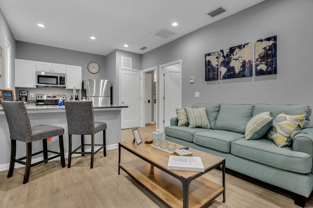 a living room with a couch and a table at New 1/1 :Loft Minutes From Heart of Tampa -Unit C in Tampa