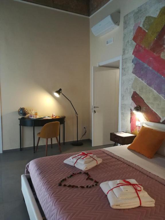 Postel nebo postele na pokoji v ubytování L'arco e il vico