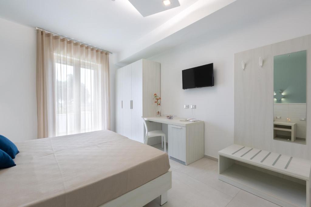 Postel nebo postele na pokoji v ubytování Alfema Rooms