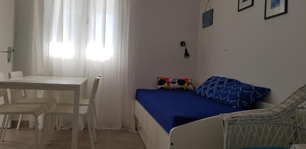Posteľ alebo postele v izbe v ubytovaní Apartmani Balažić
