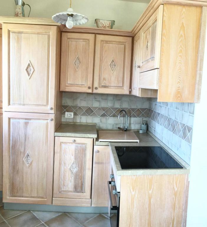 A kitchen or kitchenette at Il Tramonto Tanca Piras