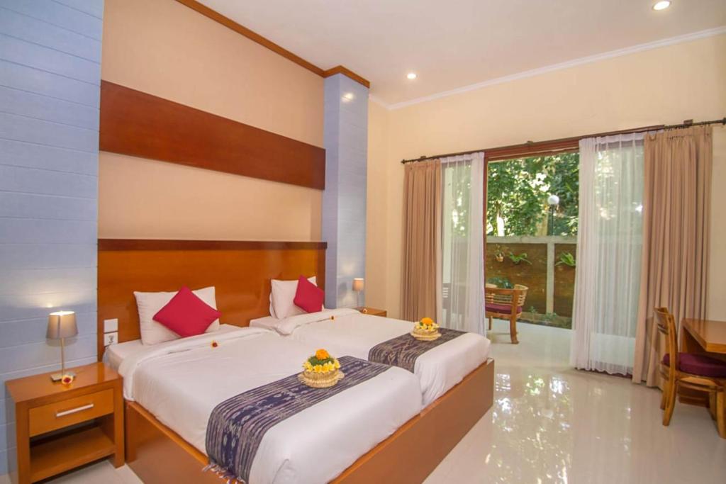 Postel nebo postele na pokoji v ubytování Adi Jaya Cottages Ubud Suites by EPS - CHSE Certified