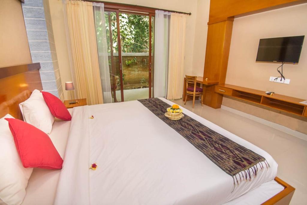 TV a/nebo společenská místnost v ubytování Adi Jaya Cottages Ubud Suites by EPS - CHSE Certified